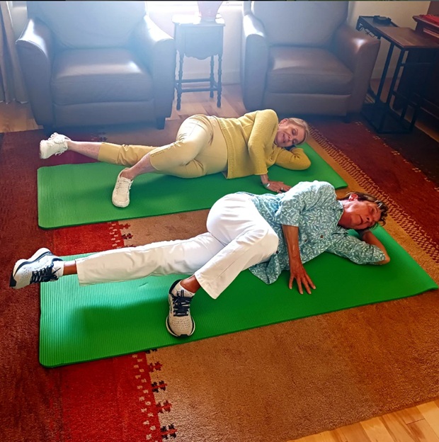 Two clients training on mats